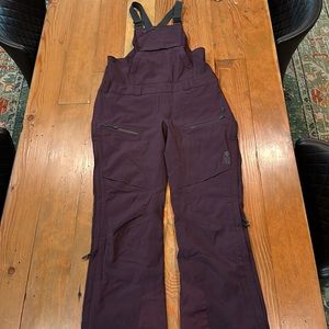 Mountain Hardwear full zip bib ski/snowboard pants. Eggplant/purple, size small.